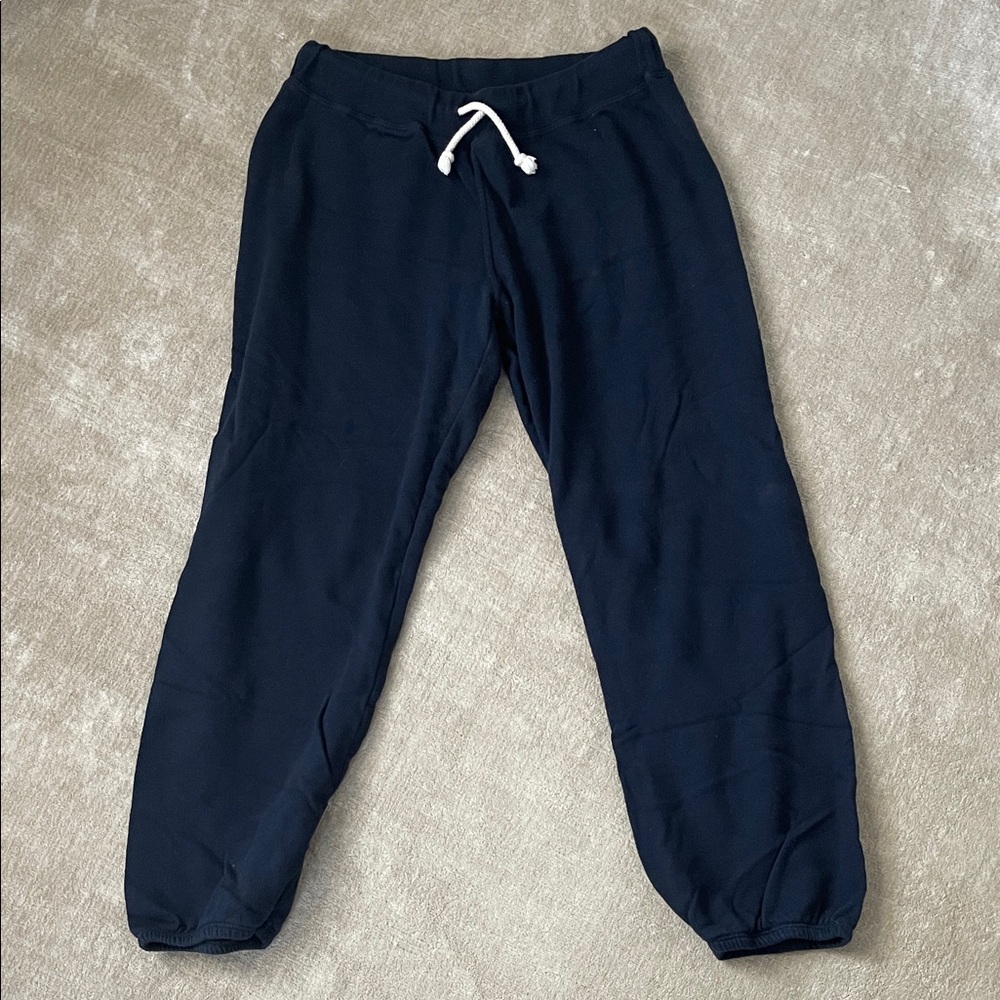perfectwhitetee Woman’s Navy sweat pants. Size
Large